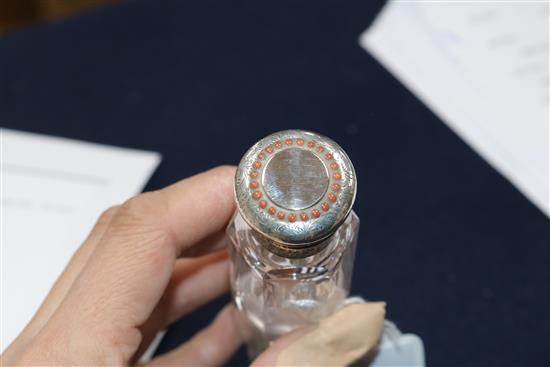 A Victorian double-ended glass scent bottle with makers mark for George Brace, the engraved mounts set with coral beads